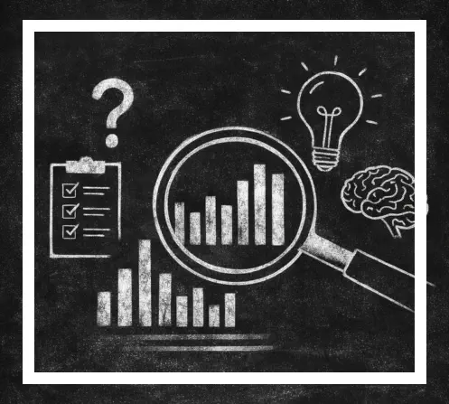Person writing on chalkboard with research and analytics symbols